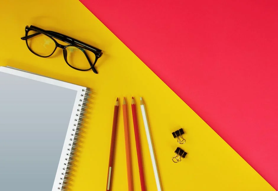 Close-up of a social media marketing document on a desk with a pen and notebook.